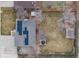 Aerial view of a home with solar panels, spacious backyard, a hot tub and a detached shed at 8063 S Otis Ct, Littleton, CO 80128