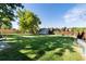 Large, well-maintained backyard featuring a storage shed and ample space for outdoor activities at 8063 S Otis Ct, Littleton, CO 80128