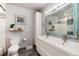 Chic bathroom with double vanity, modern fixtures, and a pristine shower at 8063 S Otis Ct, Littleton, CO 80128