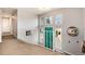 Upstairs hallway featuring a decorative railing and view of the home's entrance at 8063 S Otis Ct, Littleton, CO 80128
