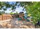 Backyard playground featuring a swing set, slide, and ample space for fun activities at 8063 S Otis Ct, Littleton, CO 80128