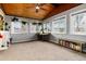 Sun room with exposed wood ceiling, lots of natural light, carpet floors, and a desk work area at 8063 S Otis Ct, Littleton, CO 80128