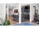 Finished basement with bar, kitchen area, ping pong table, exercise equipment, and entertainment space at 8691 S Sicily Ct, Aurora, CO 80016