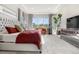 Comfortable bedroom with a large window overlooking a green lawn at 8691 S Sicily Ct, Aurora, CO 80016