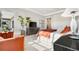 Bright bedroom boasting a tall fig plant and large windows at 8691 S Sicily Ct, Aurora, CO 80016
