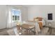 Bright bedroom with natural light and a decorative bench at the foot of the bed at 8691 S Sicily Ct, Aurora, CO 80016