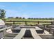 Cozy outdoor fire pit area with comfortable seating and scenic hillside views at 8691 S Sicily Ct, Aurora, CO 80016