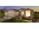 Charming home with stone and siding, landscaped yard, and a three-car garage at 8691 S Sicily Ct, Aurora, CO 80016