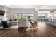 Open-concept living space with expansive windows offering natural light and picturesque outdoor views at 8691 S Sicily Ct, Aurora, CO 80016