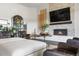 Comfortable living room with a fireplace, stylish decor, and plush seating arrangement perfect for relaxing at 8691 S Sicily Ct, Aurora, CO 80016