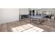 Spacious recreation room with ping pong table, casual seating, and exercise equipment at 8691 S Sicily Ct, Aurora, CO 80016