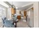 Spacious eat-in kitchen area featuring wood cabinets and stainless steel appliances at 11076 W Dumbarton Cir, Littleton, CO 80127