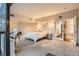 Bright bedroom with a desk, comfortable bed, and access to the staircase at 1350 Lawrence St # 2F, Denver, CO 80204