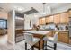 Modern kitchen with stainless steel appliances and an island with bar seating at 1350 Lawrence St # 2F, Denver, CO 80204