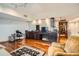Living area with hardwood floors, wet bar, and open floor plan at 1350 Lawrence St # 2F, Denver, CO 80204