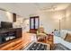 Open-concept living room with hardwood floors and modern design at 1350 Lawrence St # 2F, Denver, CO 80204