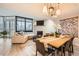 Open living and dining area with modern light fixtures and comfortable seating at 1350 Lawrence St # 2F, Denver, CO 80204