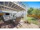 Outdoor patio with a pergola providing shade for the seating area, ideal for relaxing and entertaining guests at 9200 W Indore Dr, Littleton, CO 80128