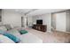 Finished basement living area featuring plush sectional sofa at 9200 W Indore Dr, Littleton, CO 80128