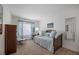 Bright bedroom featuring a daybed with patterned blue bedding at 9200 W Indore Dr, Littleton, CO 80128