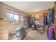 Unique bedroom closet area with fireplace and bright window at 9200 W Indore Dr, Littleton, CO 80128