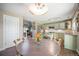 Bright kitchen and dining area with granite countertops and stainless steel appliances at 9200 W Indore Dr, Littleton, CO 80128