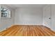 Bright bedroom with hardwood floors and a window with shutters at 7058 S Madison Way, Centennial, CO 80122