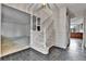Inviting foyer with tile flooring, leading to carpeted staircase and adjacent living spaces at 7058 S Madison Way, Centennial, CO 80122