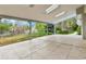 Spacious covered patio offering views of the private backyard and mature trees at 7058 S Madison Way, Centennial, CO 80122