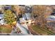 An aerial view of a home shows the well-kept landscaping and long driveway at 5450 Mohawk Rd, Littleton, CO 80123