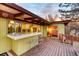 Backyard patio with bar and outdoor seating area off the main bedroom at 5450 Mohawk Rd, Littleton, CO 80123