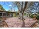 Expansive backyard deck built around a mature tree and offers plenty of room to entertain at 5450 Mohawk Rd, Littleton, CO 80123