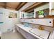 Bathroom with double sinks, sleek cabinetry, and ample counter space, combining functionality with design at 5450 Mohawk Rd, Littleton, CO 80123