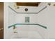 Stylish bathroom features a soaking tub with decorative tile accents, and modern fixtures at 5450 Mohawk Rd, Littleton, CO 80123
