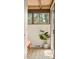 Bedroom corner showcasing natural light and a plant near the sliding glass door at 5450 Mohawk Rd, Littleton, CO 80123