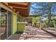 Spacious deck has a covered area with serving bar and access to the home's interior at 5450 Mohawk Rd, Littleton, CO 80123