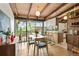 Dining room with bright lighting, sleek furniture, an open layout, and deck access for outdoor dining at 5450 Mohawk Rd, Littleton, CO 80123
