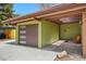 Stylish garage exterior featuring a modern door and adjacent walkway, adding curb appeal to the property at 5450 Mohawk Rd, Littleton, CO 80123