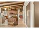 Hallway featuring stylish decor leading into a bright kitchen with an open layout at 5450 Mohawk Rd, Littleton, CO 80123