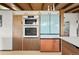Modern kitchen features stylish cabinetry, stainless steel appliances including oven and refrigerator with unique color accents at 5450 Mohawk Rd, Littleton, CO 80123