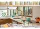 Modern kitchen boasts sleek countertops, a stylish faucet, stainless steel appliances, and is well-lit at 5450 Mohawk Rd, Littleton, CO 80123