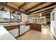 Well-lit kitchen features modern appliances, sleek cabinetry, an eye-catching window with an open design at 5450 Mohawk Rd, Littleton, CO 80123