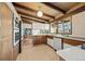 Bright kitchen features stainless steel appliances, sleek countertops, and an open design with modern features at 5450 Mohawk Rd, Littleton, CO 80123