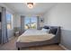 Bedroom with a queen bed, large windows, and neutral color palette at 1426 Harvest Dr # 1426, Lafayette, CO 80026