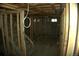 Unfinished basement with exposed framing, electrical wiring, and potential for customization at 3091 S Holly Pl, Denver, CO 80222