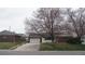 Charming single Gathering home featuring a brick and vinyl exterior with a two car garage at 3091 S Holly Pl, Denver, CO 80222