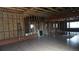 Framed living room with exposed wood and spacious layout, ready to be customized at 3091 S Holly Pl, Denver, CO 80222