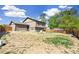 Large backyard awaiting landscaping, enclosed by a wood fence, offering great potential at 9605 Orangewood Dr, Thornton, CO 80260