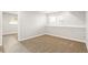 Bright, carpeted basement with neutral walls, offering a versatile space for various uses at 9605 Orangewood Dr, Thornton, CO 80260