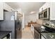 Modern kitchen with stainless steel appliances, ample counter space, and stylish backsplash at 9605 Orangewood Dr, Thornton, CO 80260